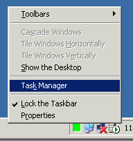 Right click an unoccupied area on the task bar and select Task Manager
