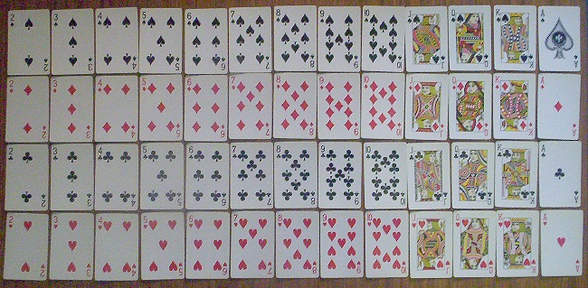 a complete deck of 52 cards, arranged by suit and in ascending order
