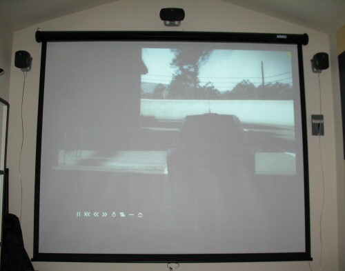 Projector screen and speakers