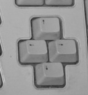 keyboard with non-standard arrow key cluster